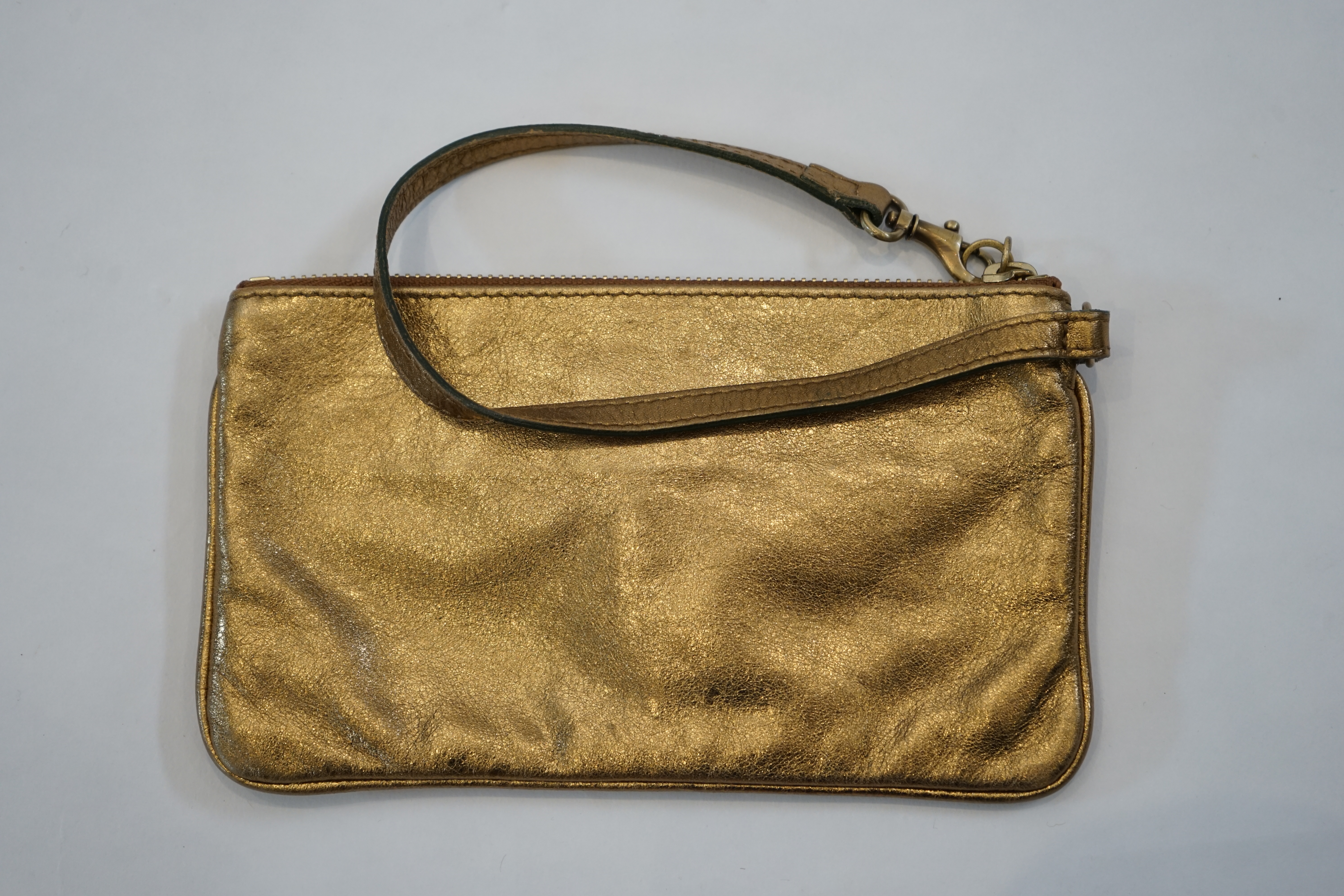 A Burberry gold leather clutch bag with original dust bag, approx length 19.5cm, height 11cm